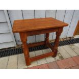 A Robert Thompson "Mouseman" oak stool. 39cm high.