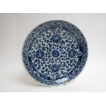 A blue and white Chinese charger with character marks to base,