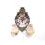 A pair of 19th Century double arm wall sconces created from Japanese Imari chargers mounted in