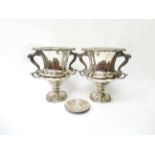 A pair of late 19th Century plated wine coolers, one lid missing,