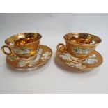 Two Murano glass cups and saucers