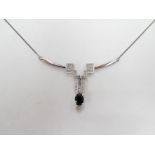 A white gold chain with Art Deco style diamond and blue sapphire pendant on bar, stamped 375, 4.