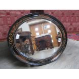 A Chinoiserie oval mirror with bevelled glass, 60cm x 49.