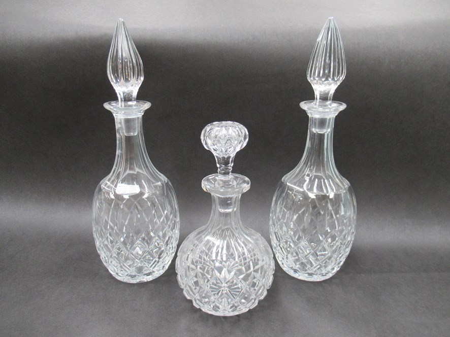 A pair of Brierley crystal diamond cut decanters with spier-shaped stoppers.