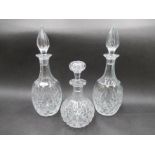 A pair of Brierley crystal diamond cut decanters with spier-shaped stoppers.