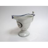 A French 18th Century milk/cream jug with pedestal foot, crested detail, 12.