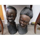 A pair of large carved African hardwood busts of lady and gentleman,