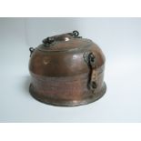 An Arabic copper lidded container with tray and pot contents,