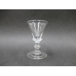 A late 18th early 19th Century dram glass with deceptive conical bowl set on a collar and short