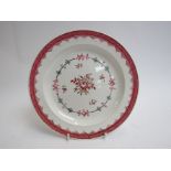An 18th Century English plate with scale border, floral centre,