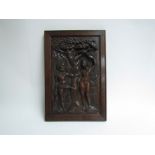A 19th Century carved oak panel of Adam and Eve,