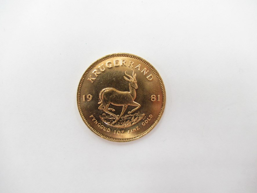 A 1981 South African Krugerrand with Chartered Bank plastic case