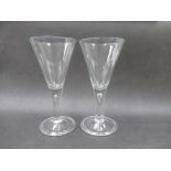 A pair of 20th Century made 18th Century style clear glass goblets,