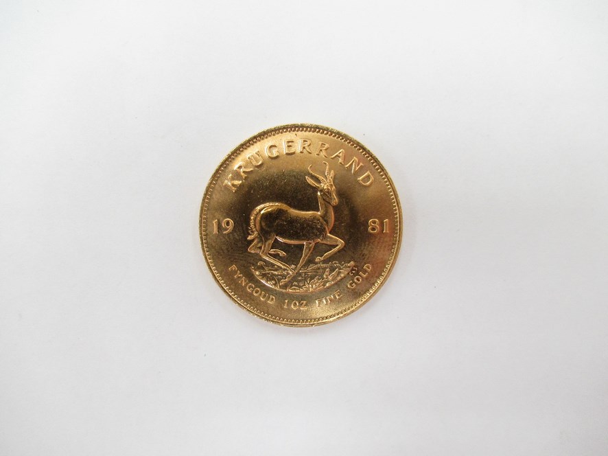 A 1981 South African Krugerrand with Chartered Bank plastic case