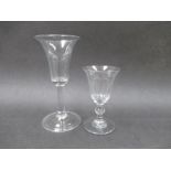 A Georgian glass with panel cut bell shaped bowl raised upon a short stem with spherical knop,