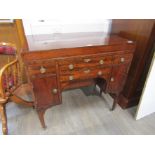 A Regency mahogany washstand, the lift opening top to reveal washbowl space and mirror,