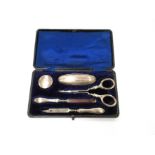 A cased silver manicure set