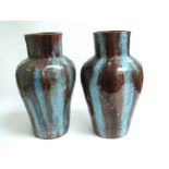 A pair of early 20th Century art pottery vases with blue and brown drip glaze, 37cm tall,