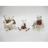 Three Royal Crown Derby mini bear figures including "Bear Hug" and "Daddy and George" etc