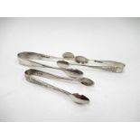 Three pairs of silver sugar tongs with bright-cut detail including W.S. Savage & Co.