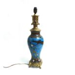 An early 20th Century cloisonné table lamp with gilt metal base and fitting,