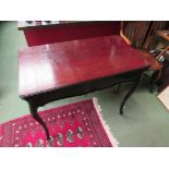 A circa 1900 mahogany games table,