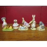 Four Royal Albert Beatrix Potter figures, "The Old Woman", "Benjamin ate a lettuce leaf",