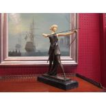 An Art Deco style bronze lady huntress on marble base,