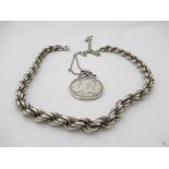 A silver heavy rope twist necklace and a 1964 JFK silver half dollar hung on chain (2)