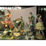 A collection of 19th Century English and Continental porcelain figures including three pairs of