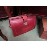 A tan leather vintage doctors attaché case,