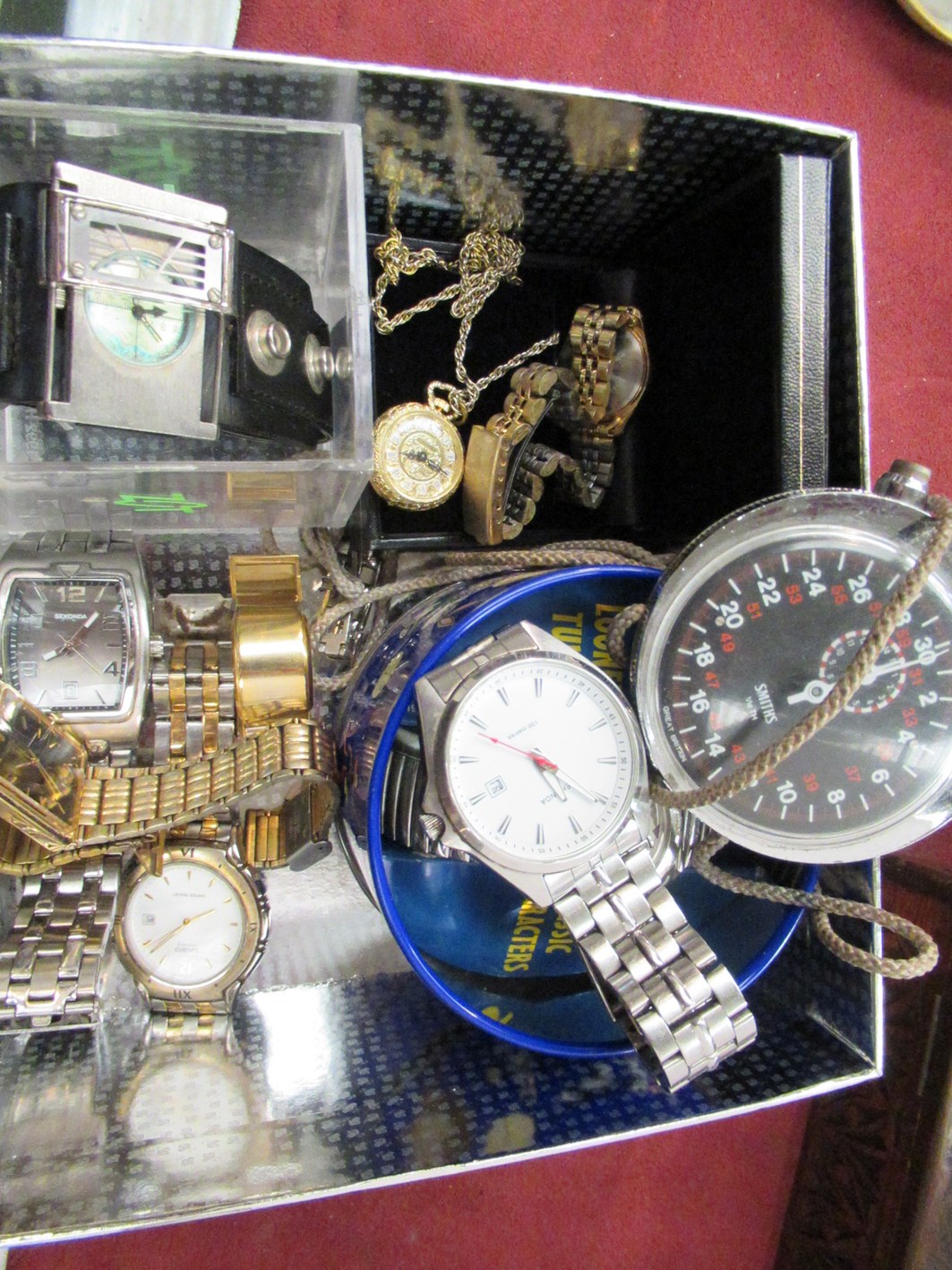 A tin containing mainly gent's wristwatches,
