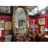 A pair of gilt girandole mirrors,