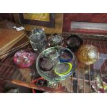 Six assorted glass paperweights including Langham and Caithness