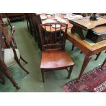 A pair of Georgian mahogany wooden chairs with dished seats