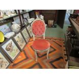 A Victorian style painted dressing table chair with button backrest and gilt relief