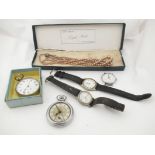 A tin containing wristwatches, pocket watches,