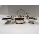 A plated three piece cruet, blue glass liners, sweet basket,