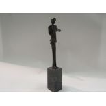 An Art Deco nude woman on an oak base,