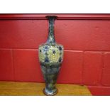 A pair of Royal Doulton glazed earthenware bottle neck vases with high relief pattern,