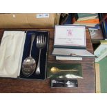 A cased cutlery set, boxed spoons,