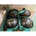 A set of Almark Sterling slim line lawn bowls,