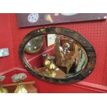 A Chinese oval bevelled edge mirror, with lacquered decoration (c.