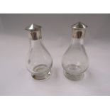 A pair of silver topped scent bottles,
