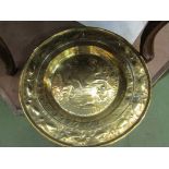 A circa 17th Century Nuremberg brass embossed Alms plate, a/f (repair to back),