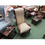 A mid Victorian fruitwood upright armchair the scroll arms over turned legs