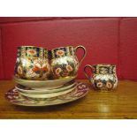 Royal Crown Derby, four 19th Century Imari coffee cans,
