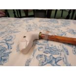 A Roy Hewson wood carved walking stick with white carved Duck handle,