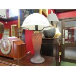 A mottled glass lamp base with a white glass shade.