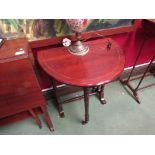 A mahogany Sutherland table with line inlay, turned legs,